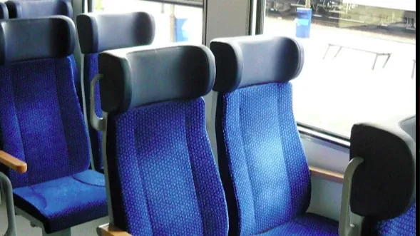 Railjet Economy class on the Vienna to Prague train — blue fabric seats